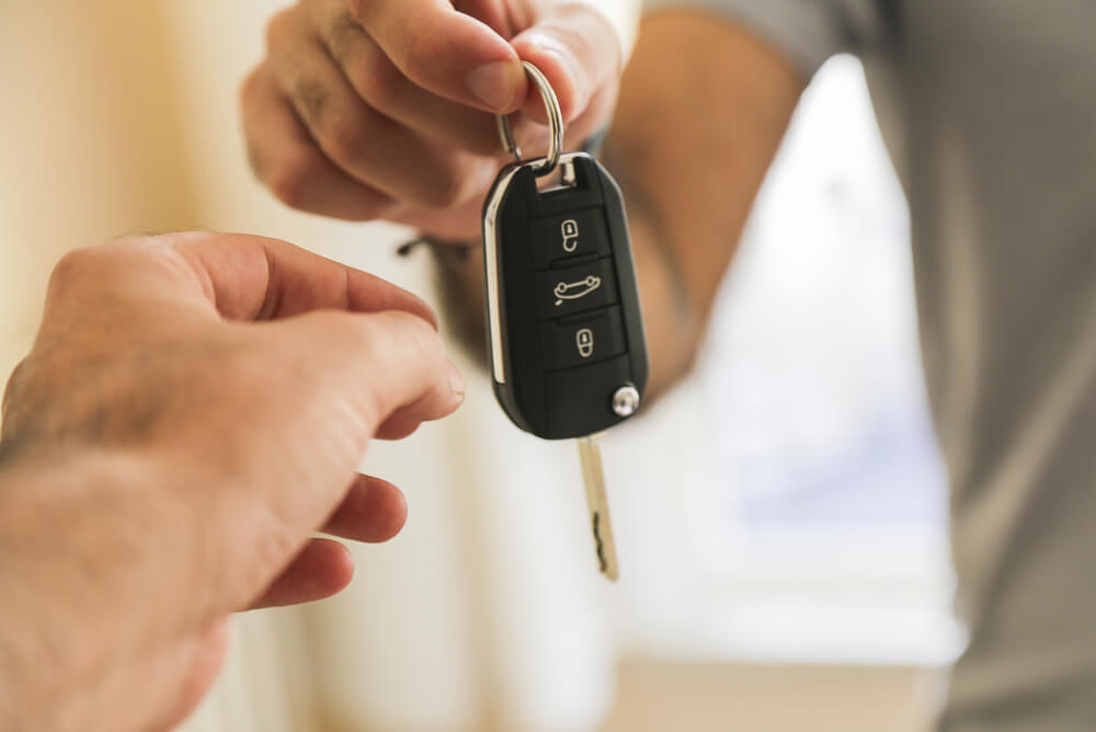 Person getting keys to new car