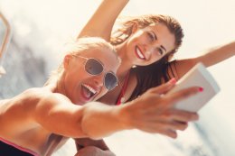 Friends taking selfie on cruise