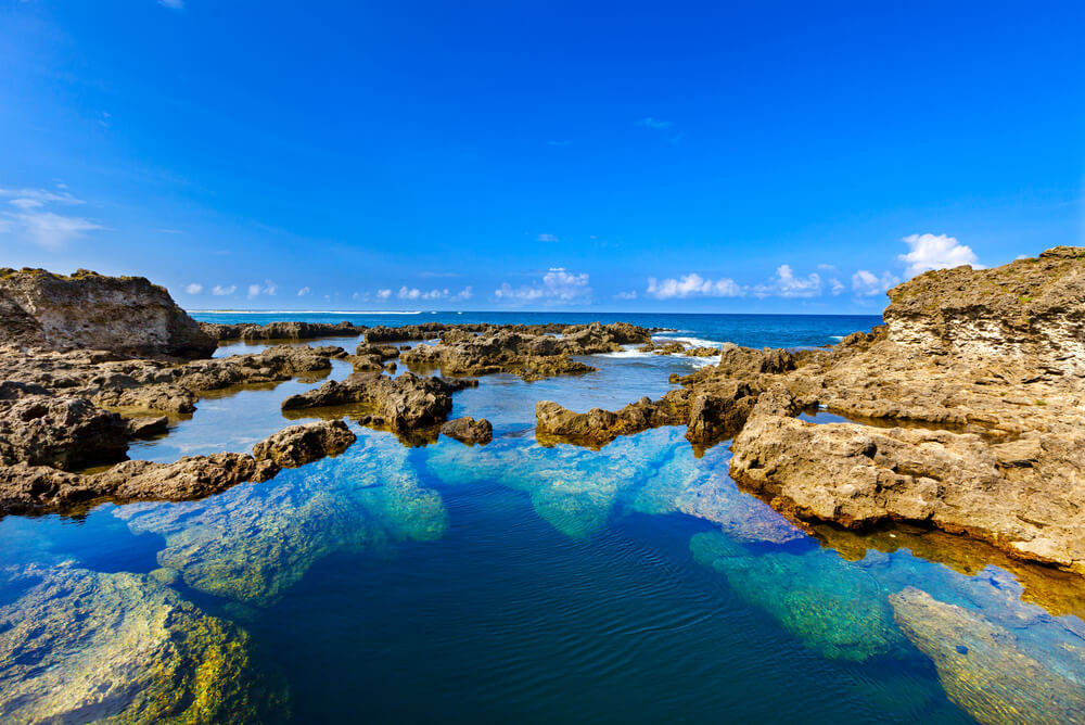 Clear water on a lava beach in tropical Tanna, Vanuatu