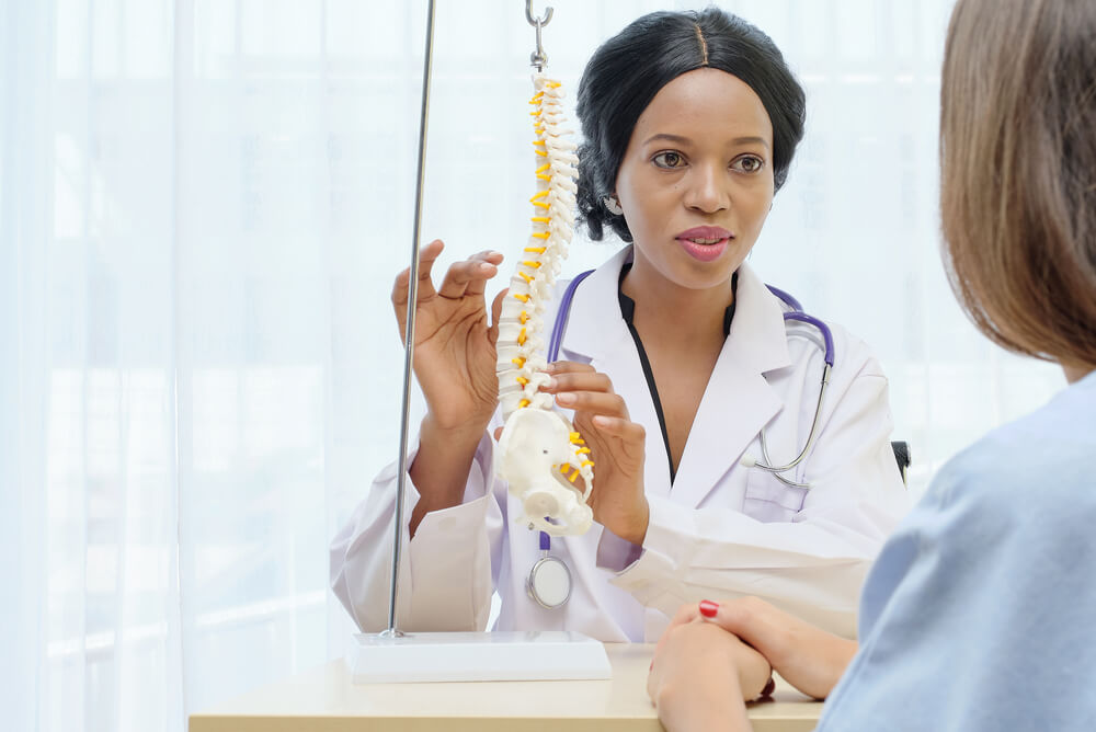 chiropractic doctor with patient