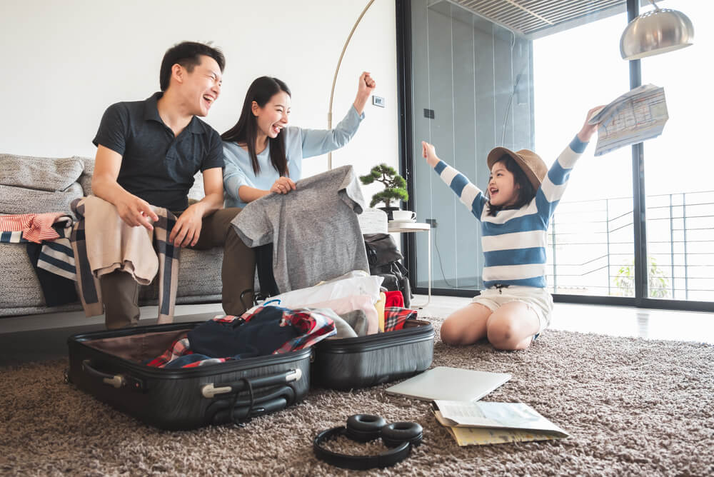 family packing luggage for an overseas holiday