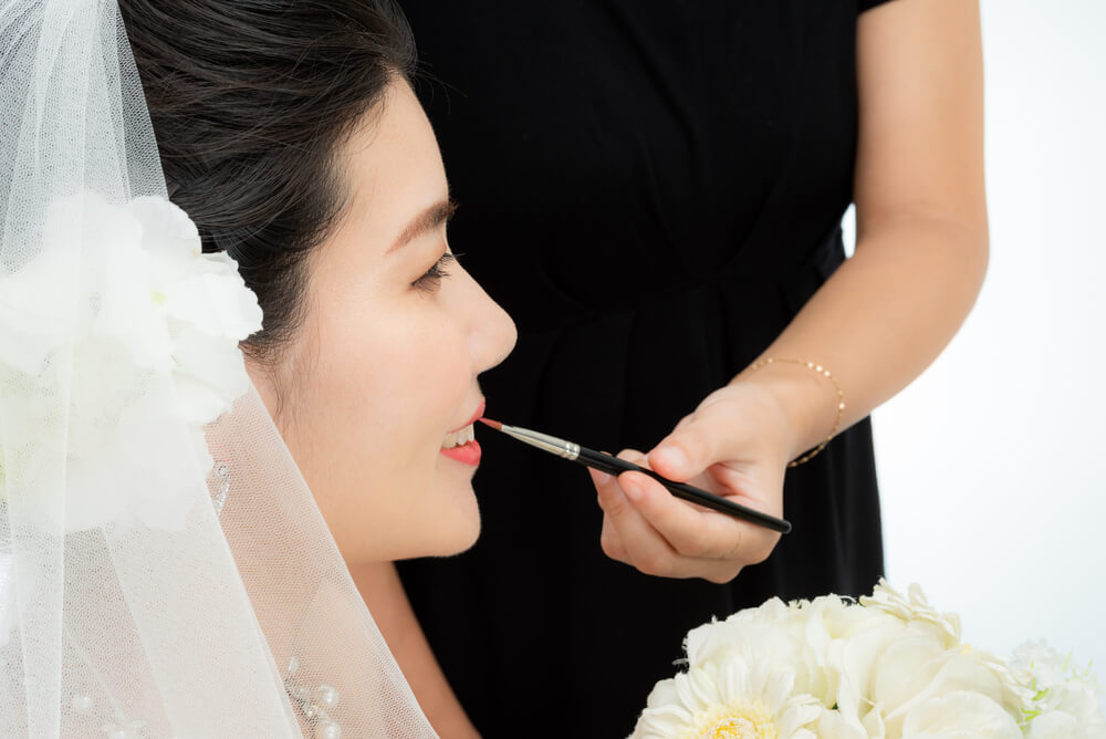 Makeup artist doing bridal makeup