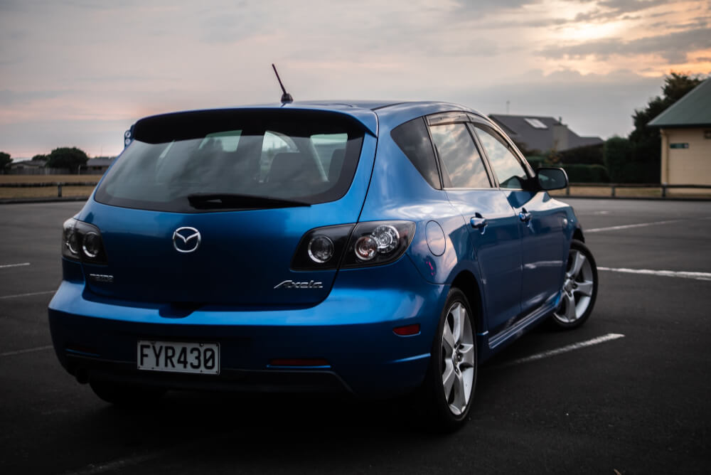A blue Mazda