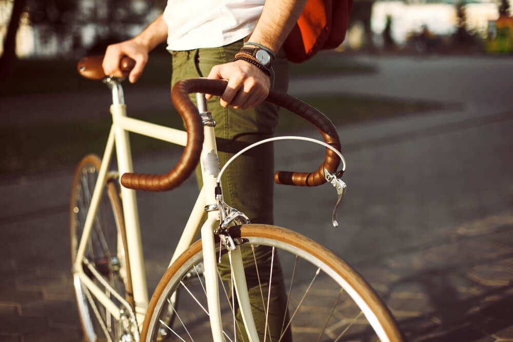 a man holding a bicycle