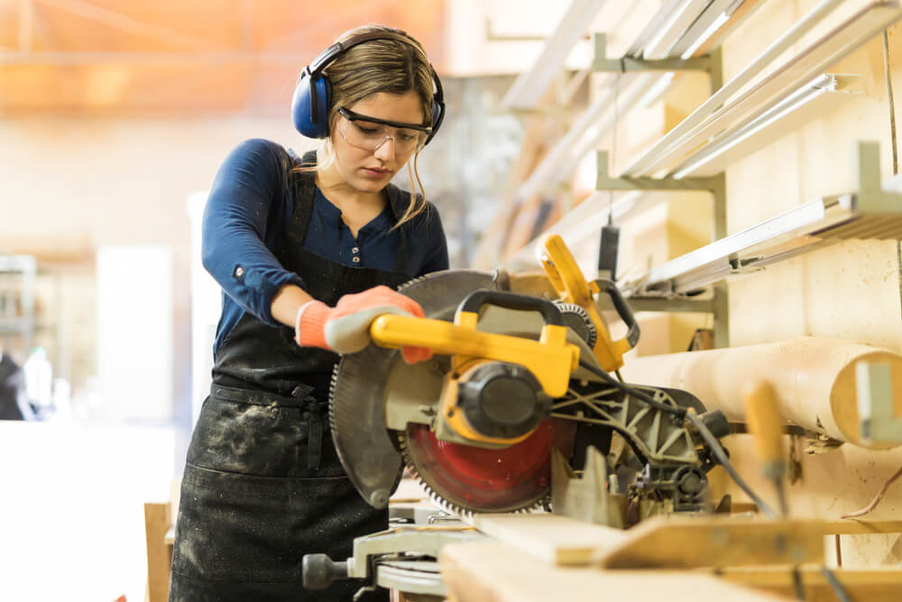 Tradesperson using a circular saw.