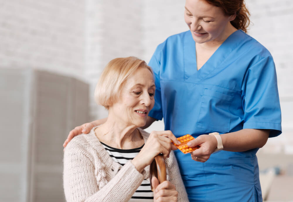 nurse giving patient medication