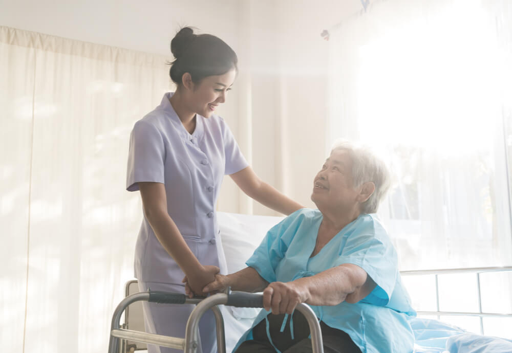 nurse helping female patient