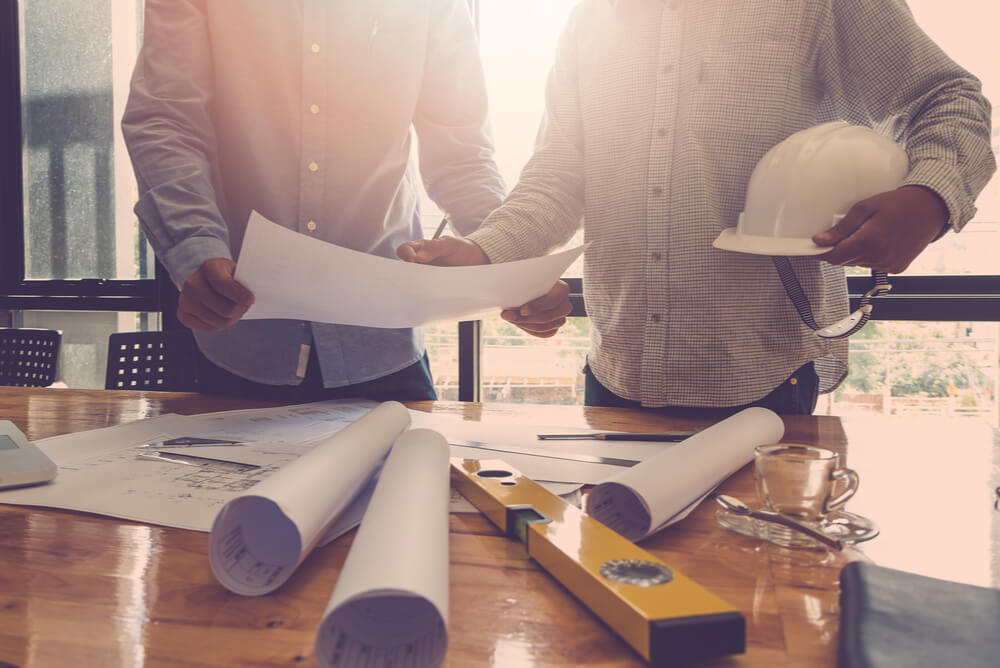 builders reviewing renovation plans