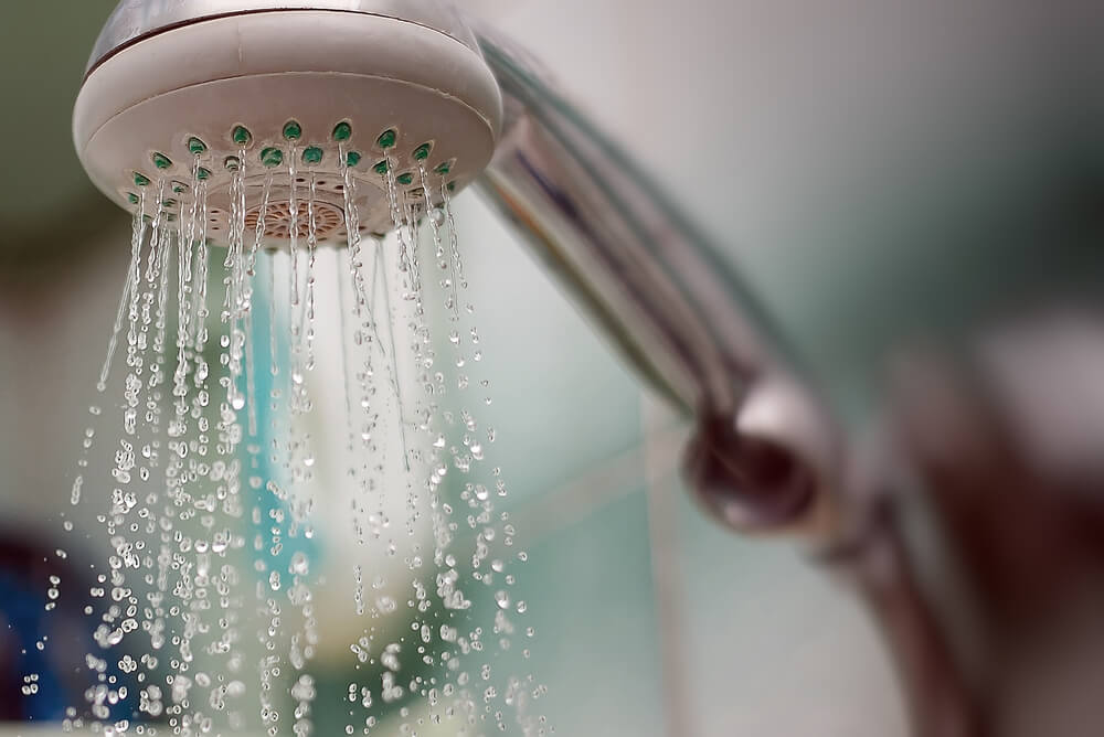 shower head supplying gas heated water