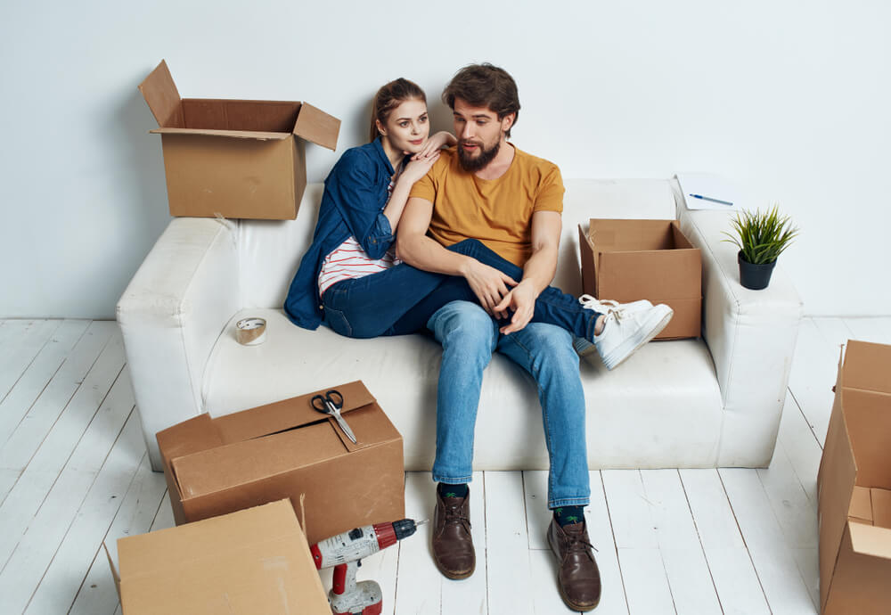 a couple taking a break while moving house