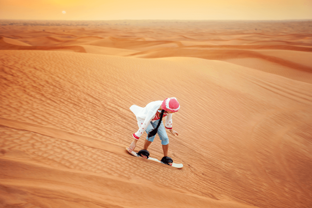 A man sandboarding in the UAE