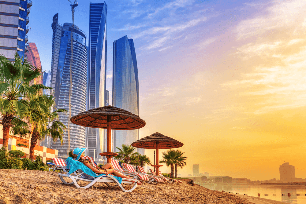 a lady sunbathing at a tourist beach in Dubai