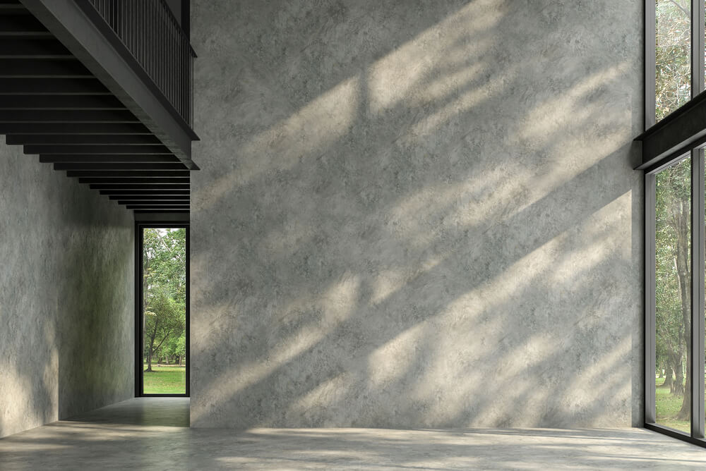 shadows falling on a concrete and steel house interior