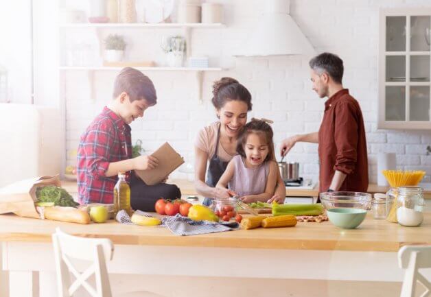 a family cooking dinner in the kitchen