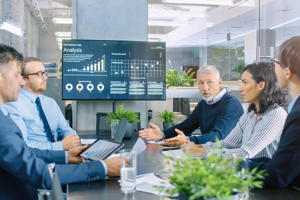 group of executives in a meeting to discuss business insurance options for directors and officers