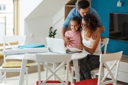 Family reviewing their standing offer electricity bills