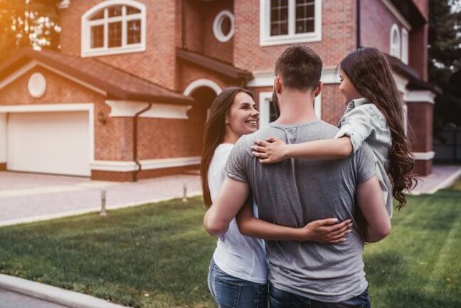 family outside house they purchased