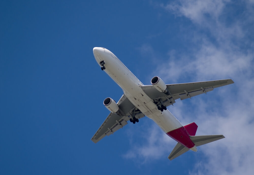 Plane flying through the sky