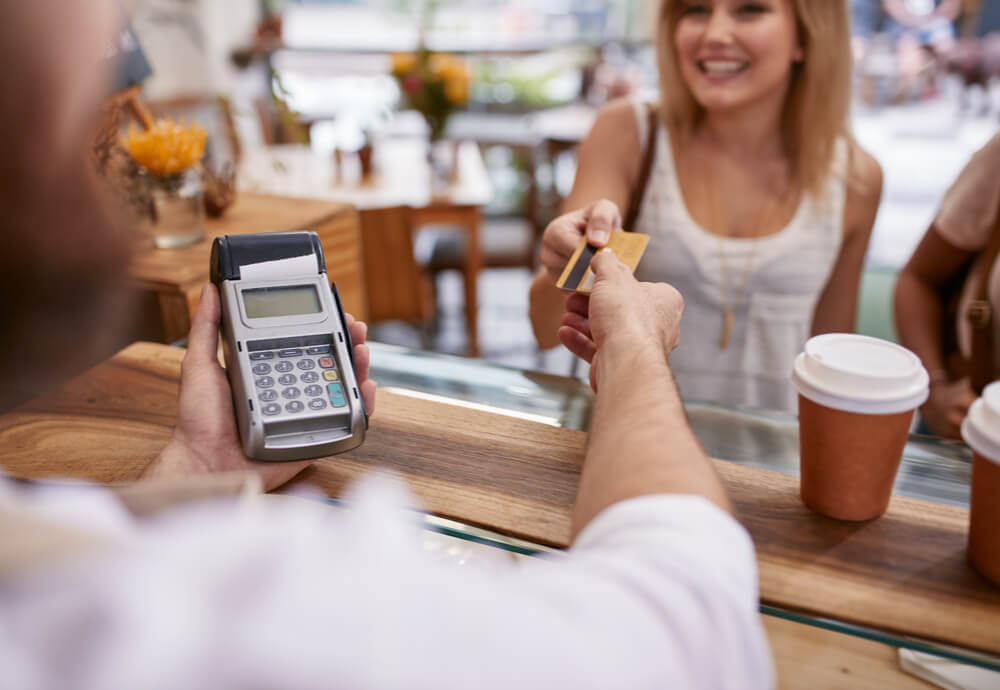 Smiling woman paying