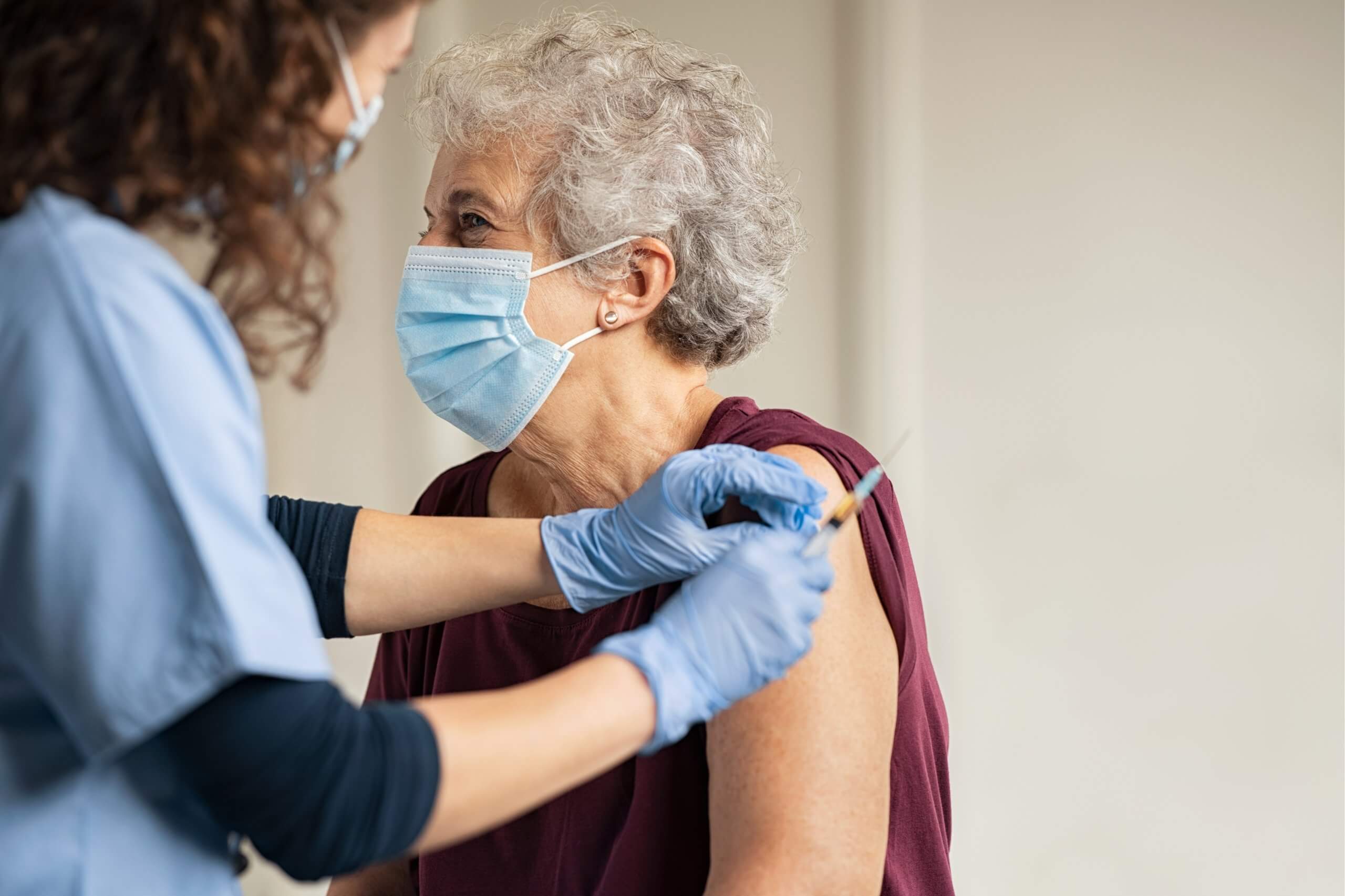 Old lady getting vaccinated