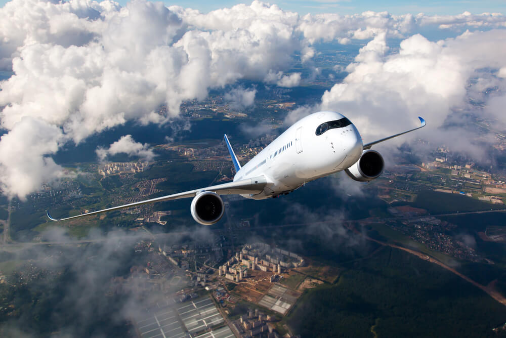 A plane flying into clouds