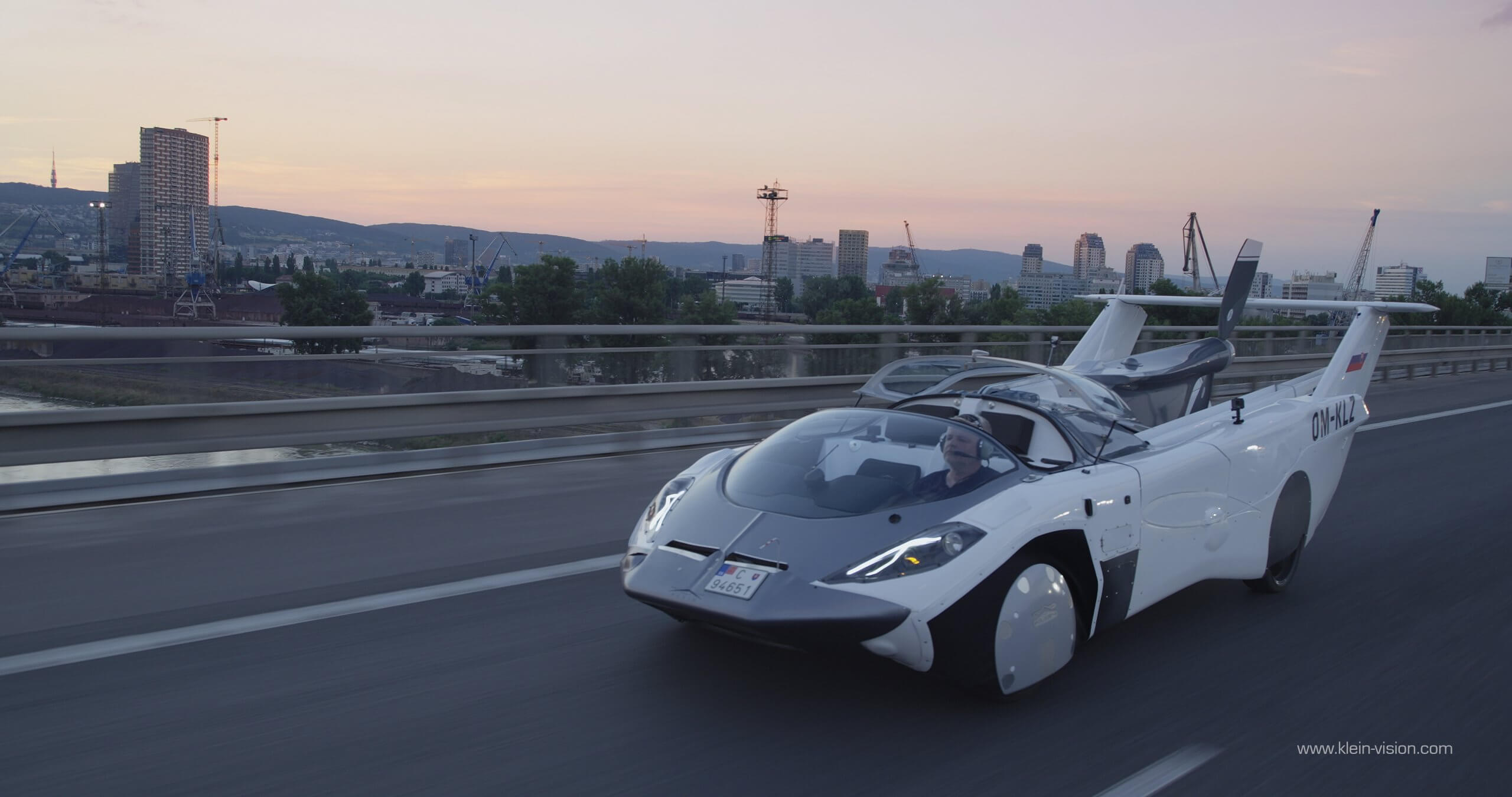 the KleinVision AirCar driving on a bridge in Bratislava