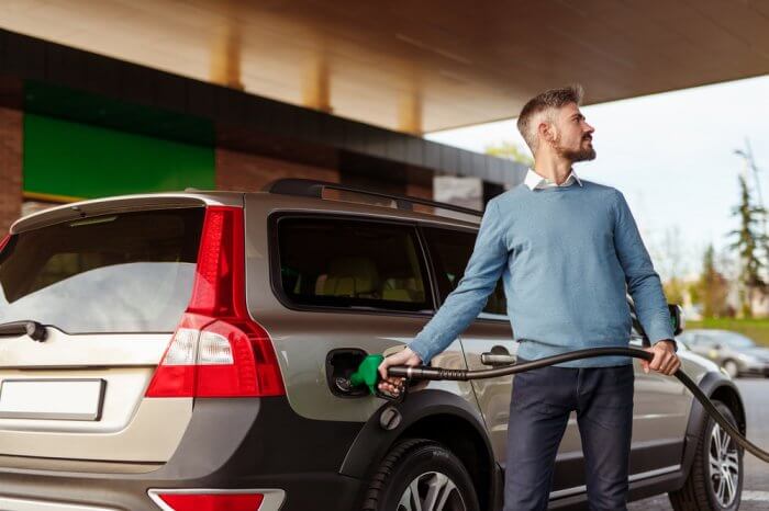 Man refuelling car at the fuel station pump