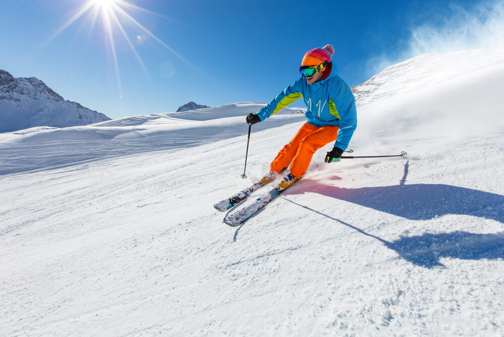Person skiing down a mountain slope