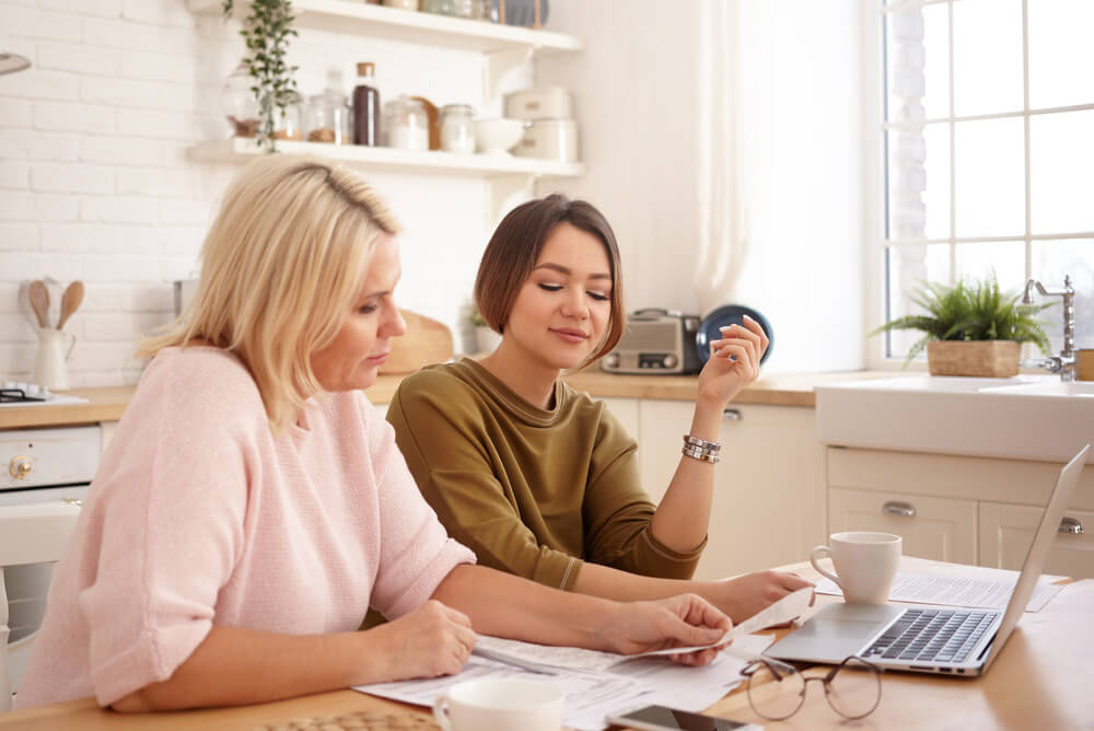 women comparing their power bill to average electricity bill prices in Australia