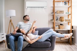 Couple using air conditioning