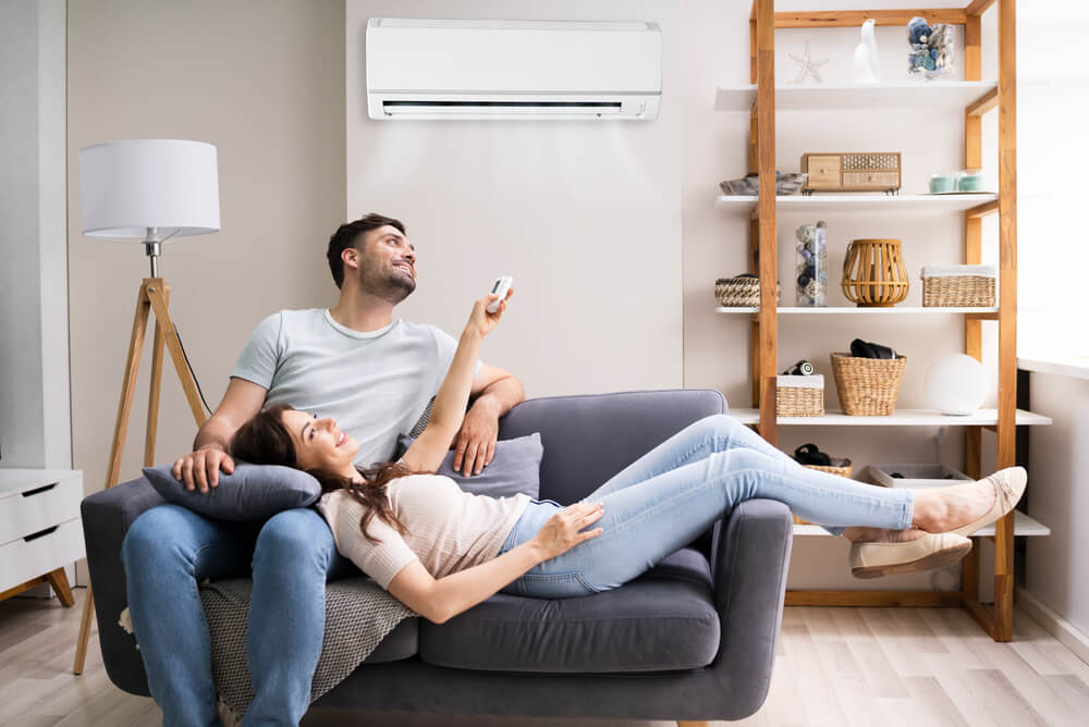 Couple using air conditioning