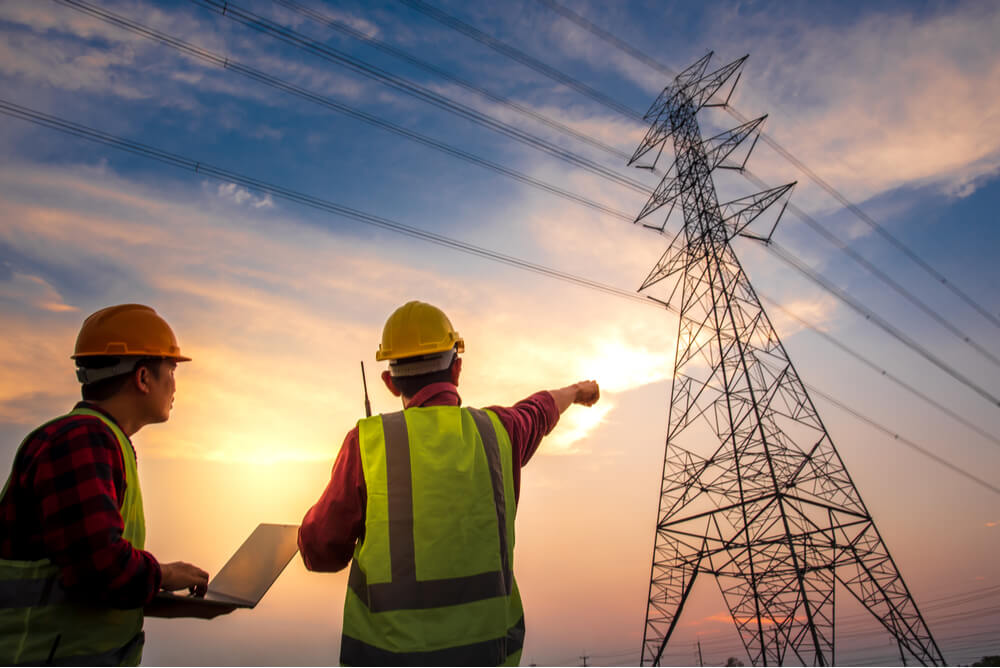 two men working on a smart grid