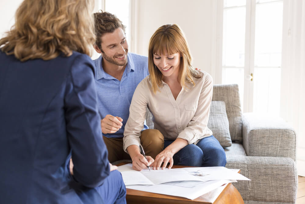 couple signing an interest only home loan