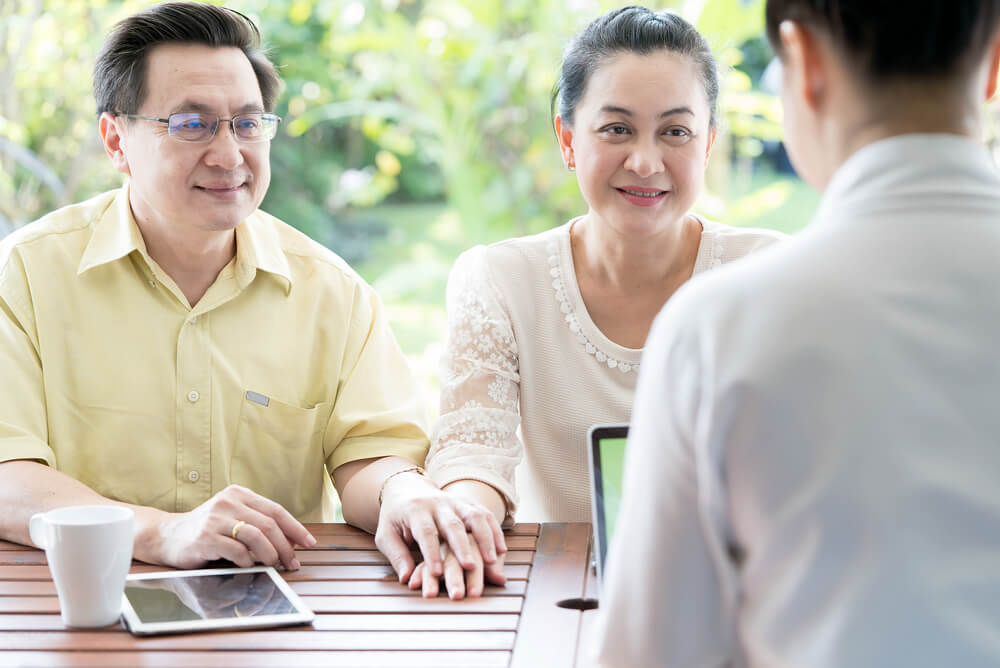 A couple discussing their life insurance beneficiary options