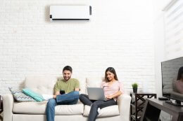 couple using air conditioning system