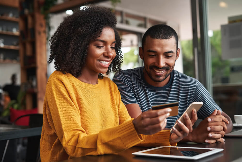 couple paying credit card debt