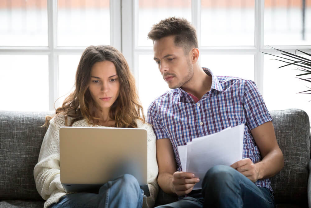 Victorian couple reading high electricity bill