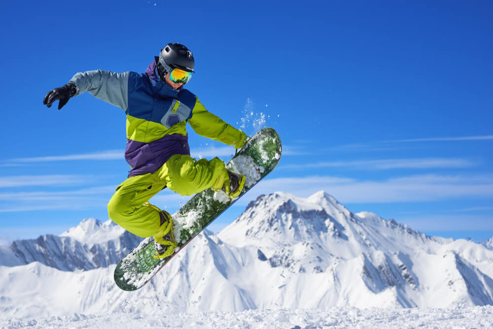 A man doing snowboarding tricks