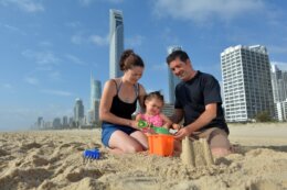 family playing on the beach in queensland