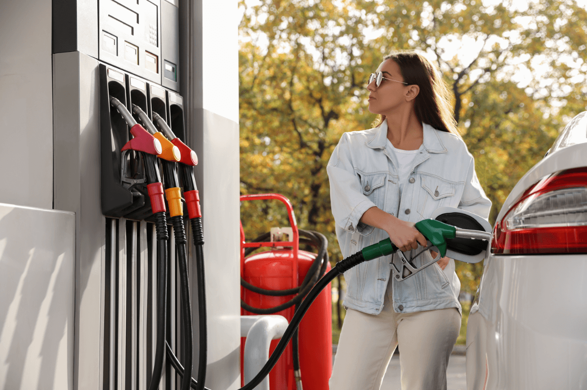 woman filling the car with petrol as prices soar