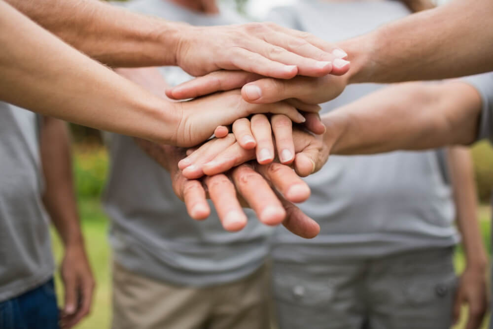 Hands together volunteering overseas