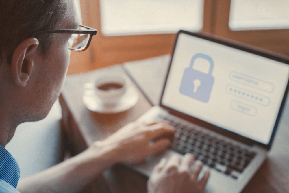 Man using a computer with data security
