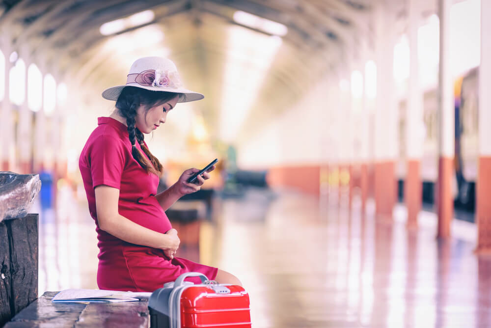 Pregnant woman on a trip with travel insurance