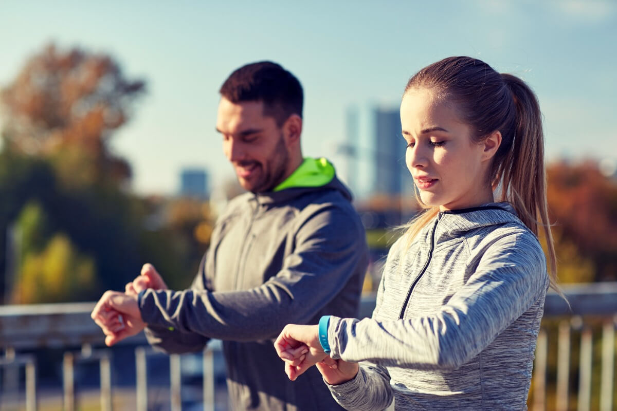 couple using smart watches for fitness