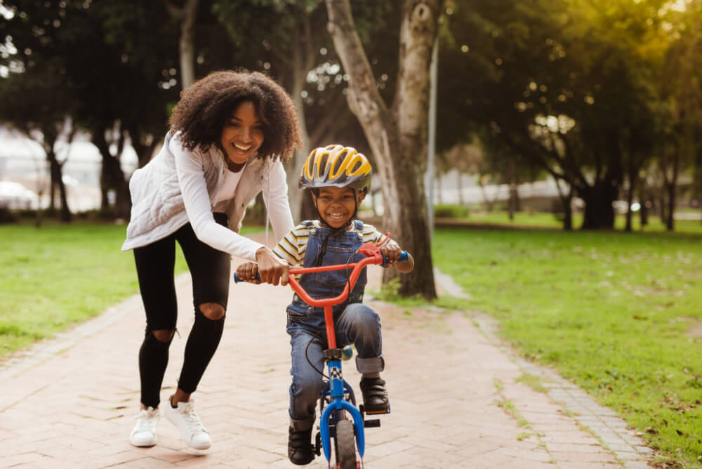 Mum plays with kid after income protection payout