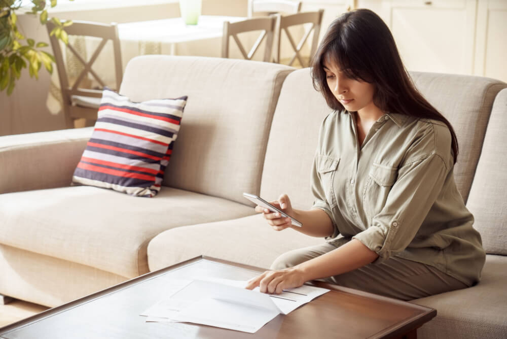 Woman checking her electricity bill