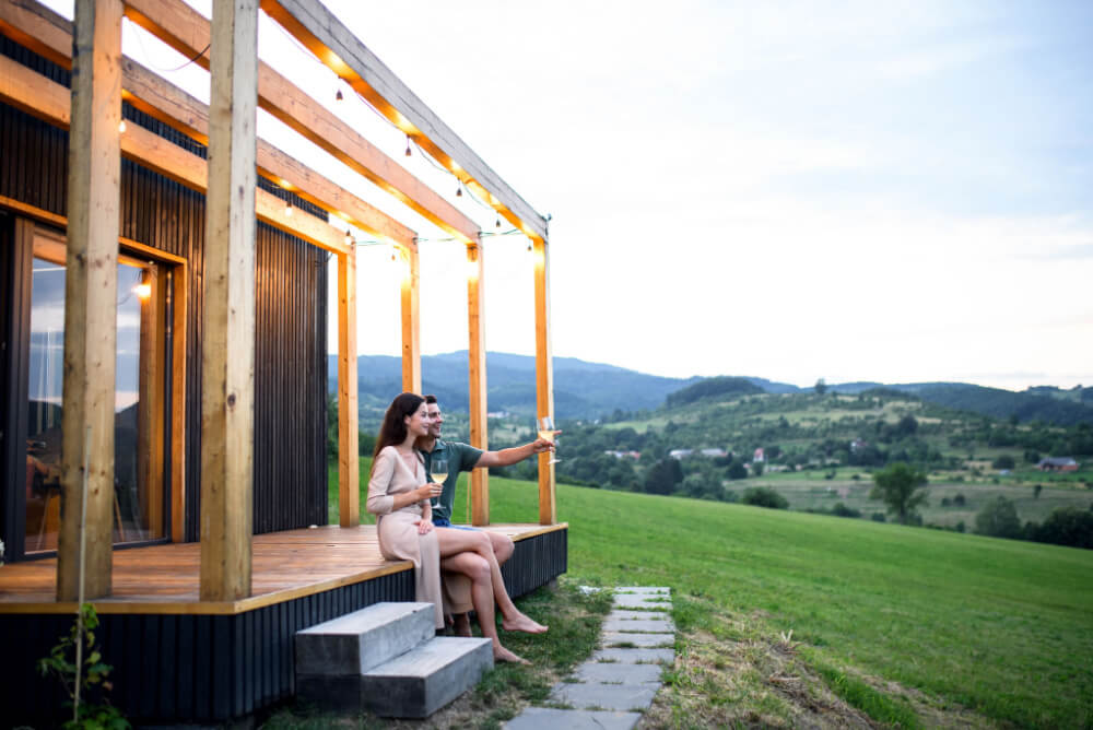 Young couple with wine outdoors