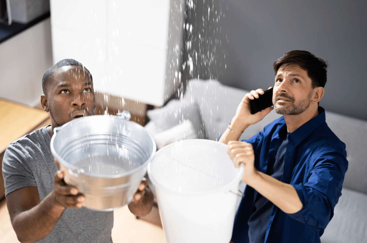 men with buckets after storm in australia