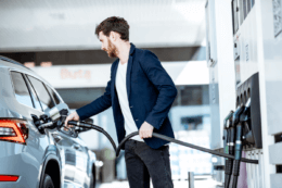 man filling his car with fuel after petrol price hike
