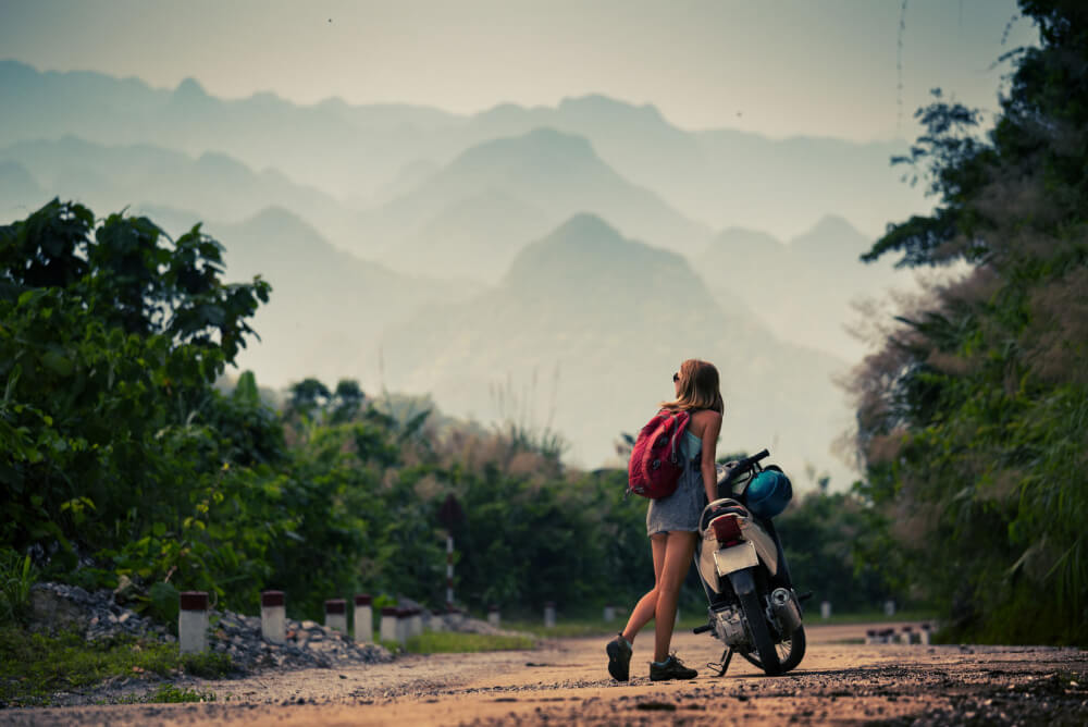 Girl travelling overseas on a moped